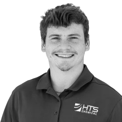 A smiling young man wearing a dark polo shirt with the logo "HTS Chemical" on it. He has short, tousled hair and is posed against a plain background.
