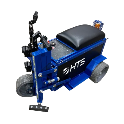 Blue and black motorized HTS Power Shaver with a padded seat, joystick controls, and a basket on the side, on a transparent background.