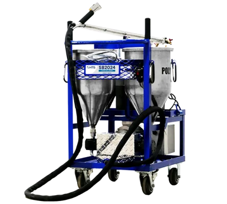 Industrial blasting machine with twin hoppers on a blue frame, equipped with hoses and nozzles, isolated on a white background.